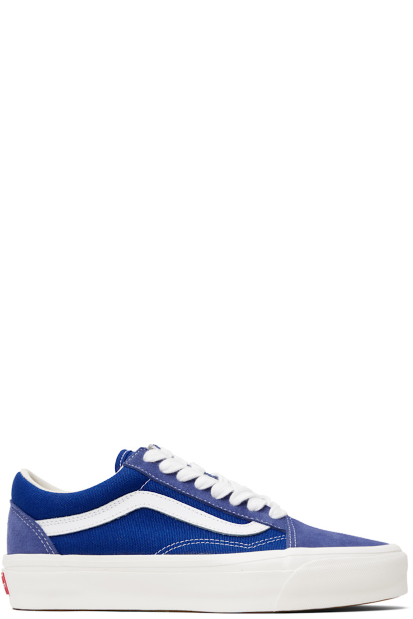 Low-top 8 oz canvas and suede sneakers in blue.

· Lace-up closure
· Padded tongue and collar
· Grained leather Sidestripe™ at sides
· Padded Sola ADC foam footbed
· Rubberized logo patch at heel
· Treaded rubber sole
· Contrast stitching in white

Part of the Premium Old Skool Music Collection. 

Supplier color: Blue