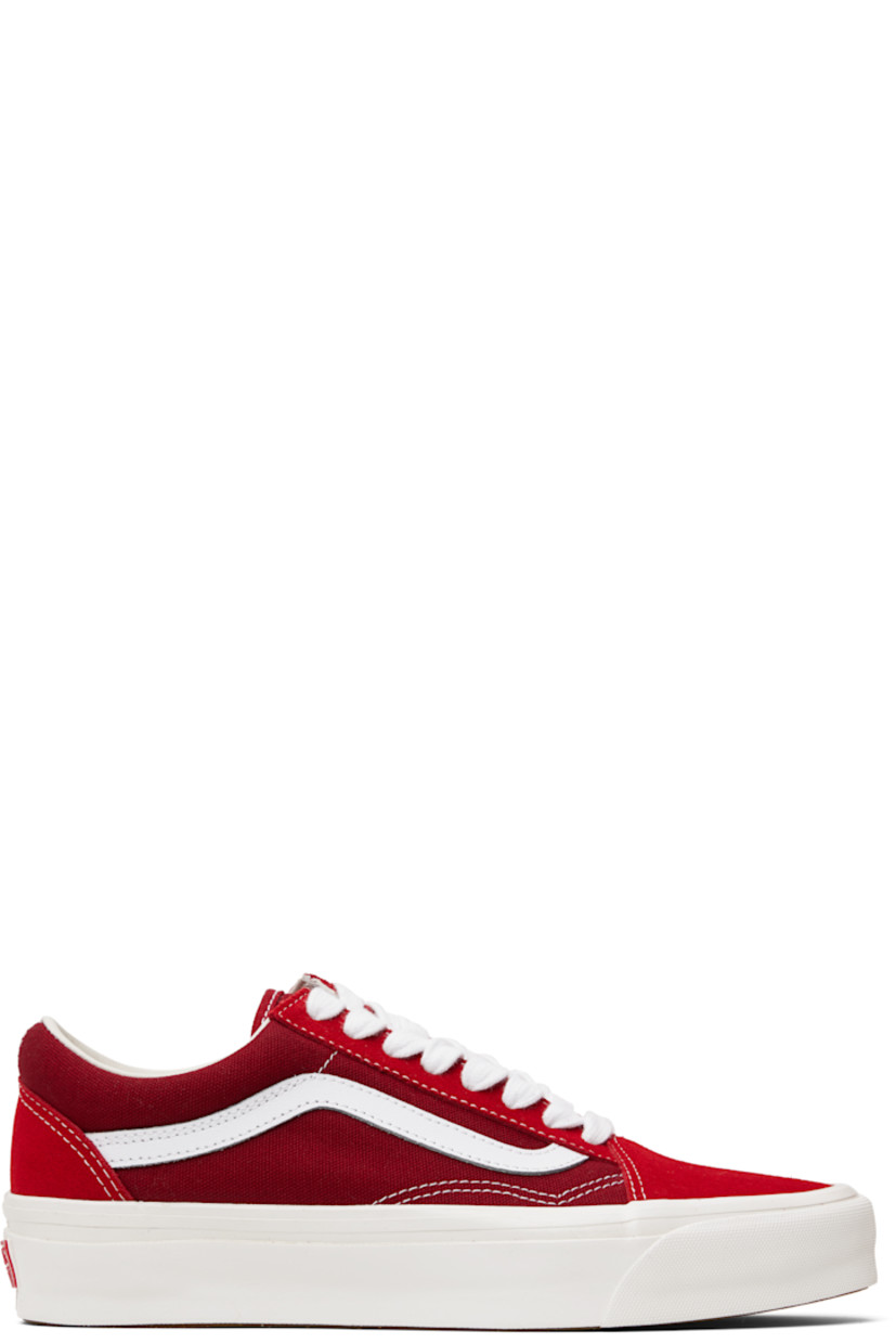 Low-top 8 oz canvas and suede sneakers in red.

· Lace-up closure
· Padded tongue and collar
· Grained leather Sidestripe™ at sides
· Padded Sola ADC foam footbed
· Rubberized logo patch at heel
· Treaded rubber sole
· Contrast stitching in white

Part of the Premium Old Skool Music Collection. 

Supplier color: Red