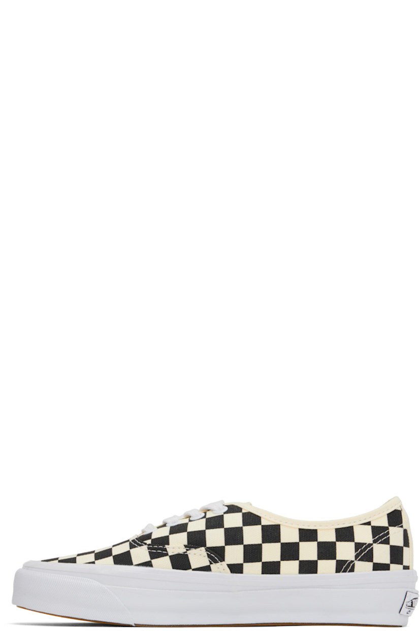 Low-top canvas sneakers in off-white and black.

· Check pattern throughout
· Lace-up closure
· Logo flag at outer side
· Grained leather and canvas lining
· Rubberized logo patch at heel
· Textured rubber midsole
· Treaded rubber sole

Supplier color: Lx checkerboard black