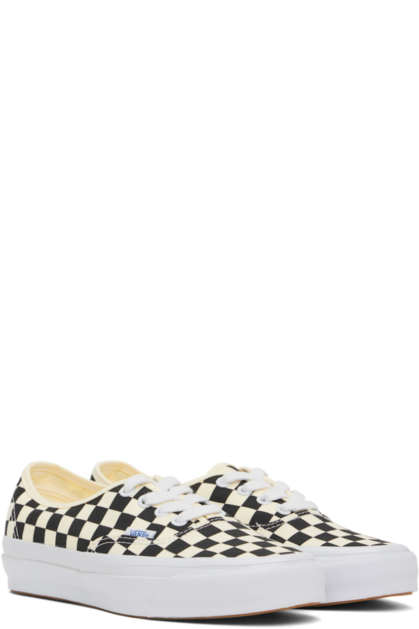Low-top canvas sneakers in off-white and black.

· Check pattern throughout
· Lace-up closure
· Logo flag at outer side
· Grained leather and canvas lining
· Rubberized logo patch at heel
· Textured rubber midsole
· Treaded rubber sole

Supplier color: Lx checkerboard black