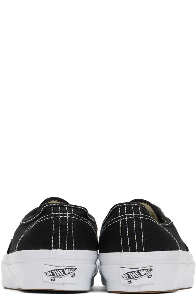 Low-top canvas sneakers in black.

· Lace-up closure
· Logo flag at outer side
· Grained leather and canvas lining
· Rubberized logo patch at heel
· Textured rubber midsole
· Treaded rubber sole

Supplier color: Lx black/White