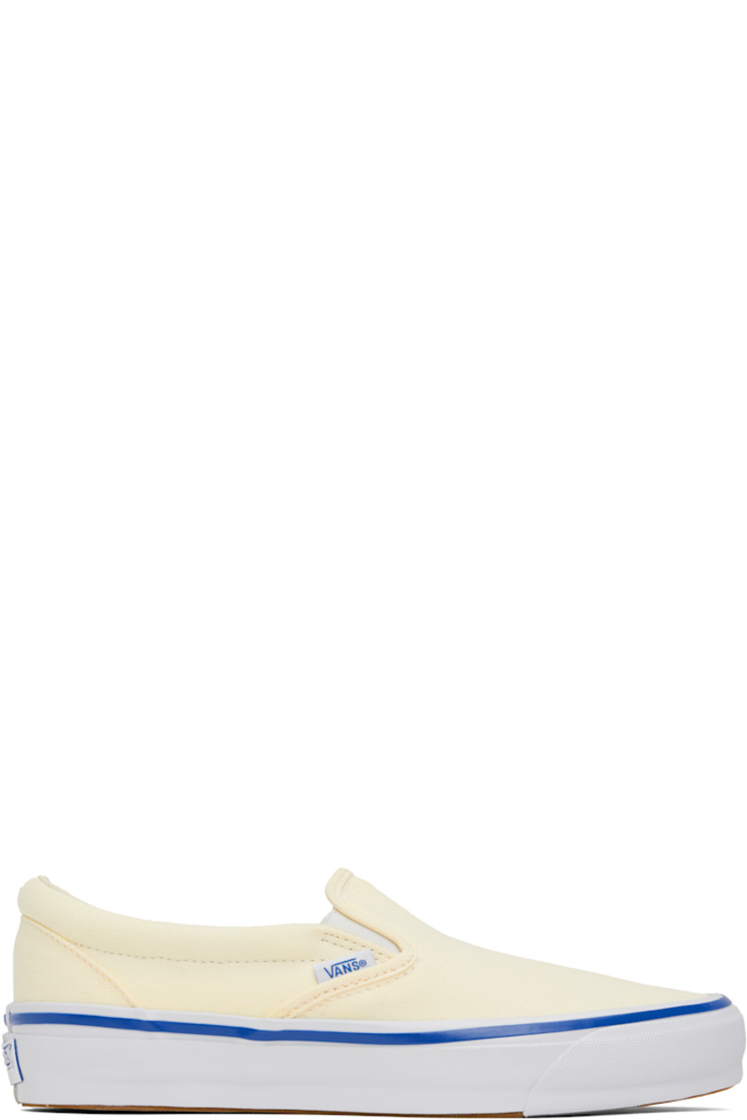 Canvas slip-on sneakers in off-white.

· Elasticized gussets at vamp
· Padded collar
· Logo flag at outer side
· Rubber logo patch at heel
· Grained leather and canvas lining
· Textured rubber midsole with blue stripe
· Treaded rubber sole

Supplier color: Lx off-white