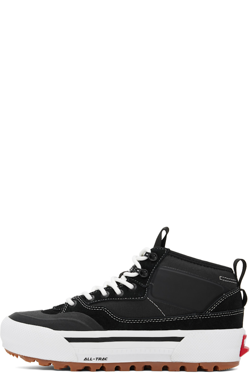 Mid-top canvas and suede sneakers in black and white.

· GORE-TEX® Duratherm-insulated
· Waterproof
· Textured rubber cap toe
· Lace-up closure
· Logo patch at padded tongue and outer side
· Pull-loop at tongue and heel collar
· UltraCush™ molded footbed
· Fleece lining
· Rubberized logo patch at heel midsole
· All-Trac treaded rubber sole

Supplier color: Black/White