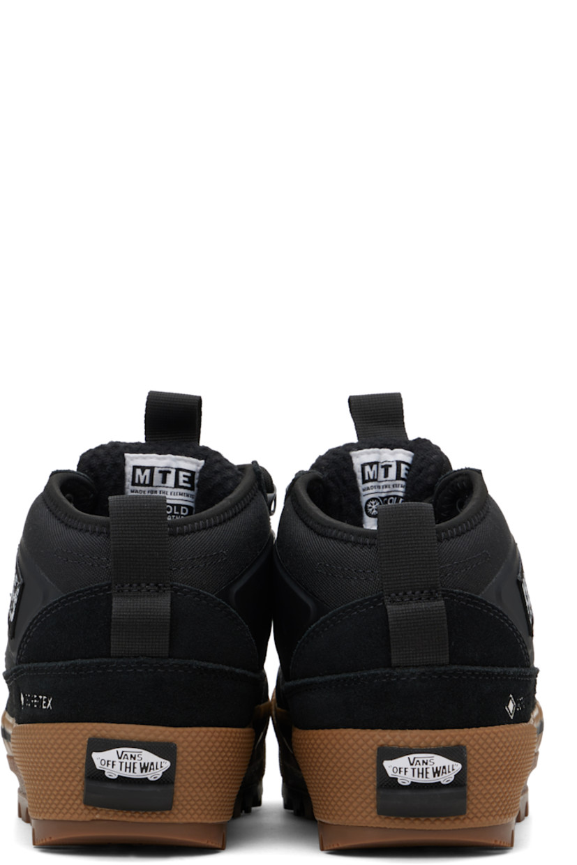 Mid-top canvas and suede sneakers in black.

· GORE-TEX® Duratherm-insulated
· Waterproof
· Textured rubber cap toe
· Lace-up closure
· Logo patch at tongue and outer side
· Pull-loop at tongue and heel collar
· UltraCush™ footbed
· Fleece lining
· Rubberized logo patch at heel
· Treaded rubber sole

Supplier color: Black/Gum