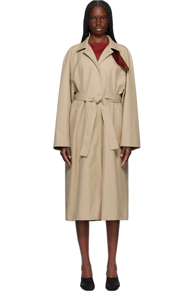 Polyester- and cotton-blend gabardine coat. 

· Detachable button tab at stand collar
· Concealed button closure
· Welt pockets
· Detachable self-tie belt at waist
· Zip vents at side seams 
· Raglan sleeves
· Central vent at back hem
· Partial satin twill lining

Supplier color: Beige