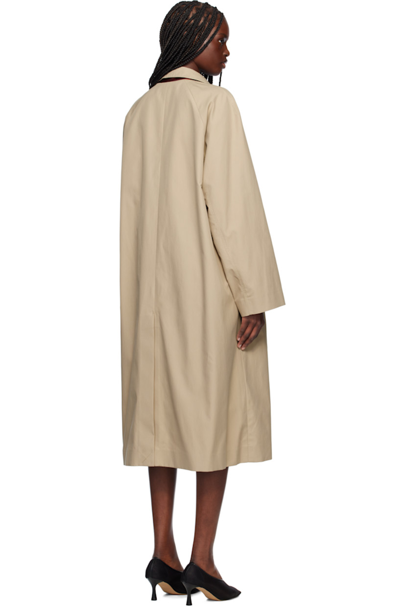 Polyester- and cotton-blend gabardine coat. 

· Detachable button tab at stand collar
· Concealed button closure
· Welt pockets
· Detachable self-tie belt at waist
· Zip vents at side seams 
· Raglan sleeves
· Central vent at back hem
· Partial satin twill lining

Supplier color: Beige