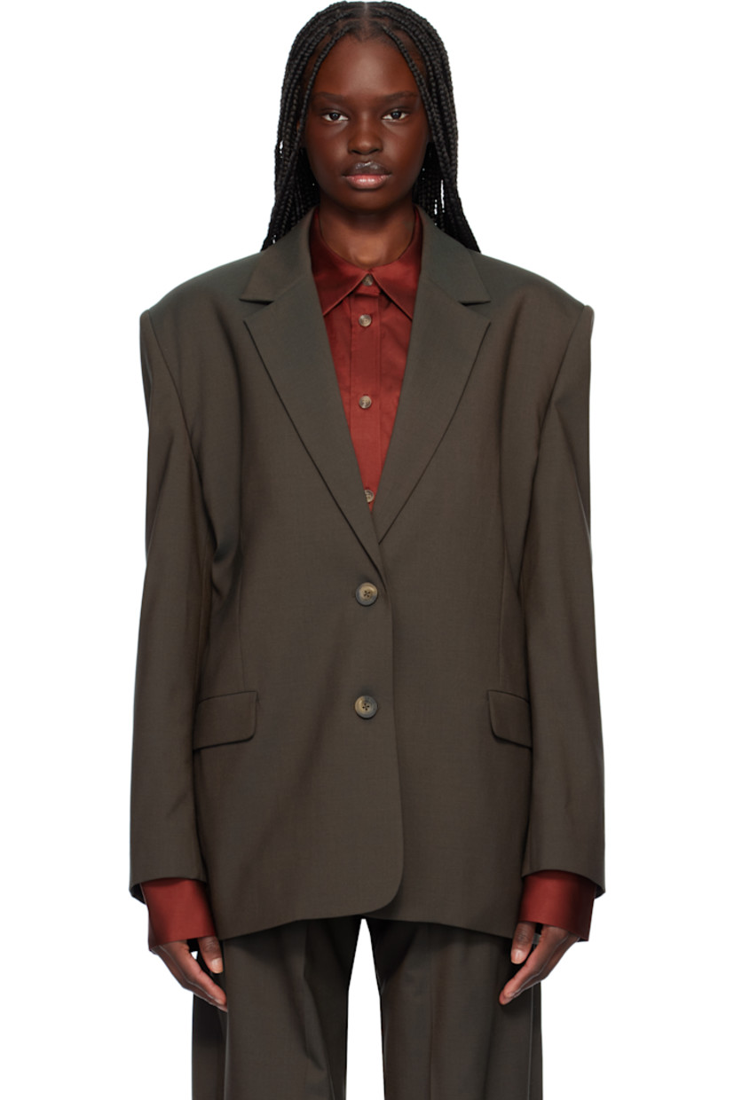 Plain-woven wool-blend blazer. 

· Notched lapel
· Button closure
· Flap pockets at waist
· Padded shoulders
· Four-button surgeon's cuffs
· Welt pockets at interior
· Partial twill lining
· Logo-engraved hardware

Supplier color: Charcoal