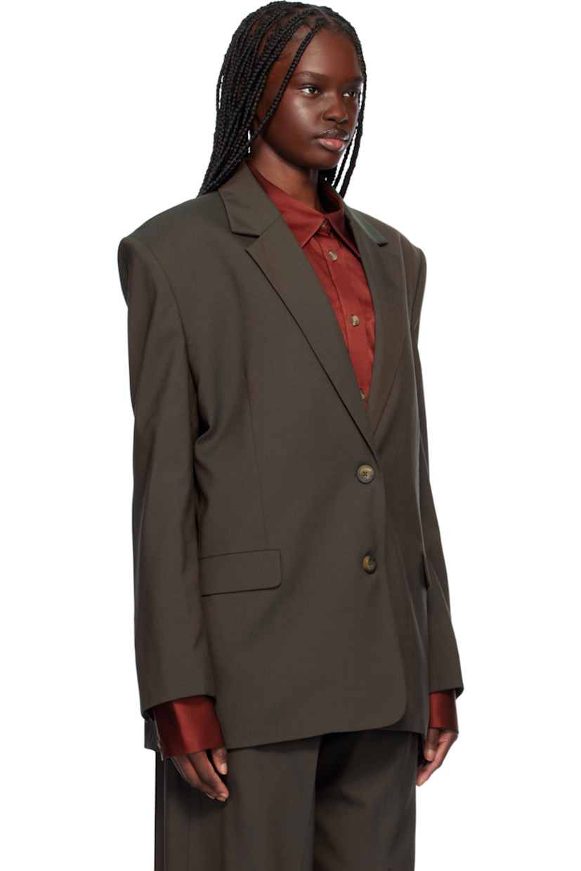 Plain-woven wool-blend blazer. 

· Notched lapel
· Button closure
· Flap pockets at waist
· Padded shoulders
· Four-button surgeon's cuffs
· Welt pockets at interior
· Partial twill lining
· Logo-engraved hardware

Supplier color: Charcoal