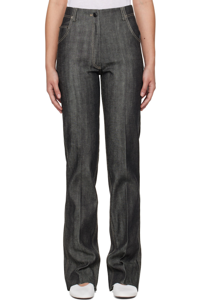 Non-stretch denim jeans. 

· Belt loops 
· Five-pocket styling 
· Zip-fly 
· Creased legs 
· Raw edge at cuffs
· Leather logo patch at back waistband 
· Vented cuffs at back 
· Contrast stitching in white

Supplier color: Indigo