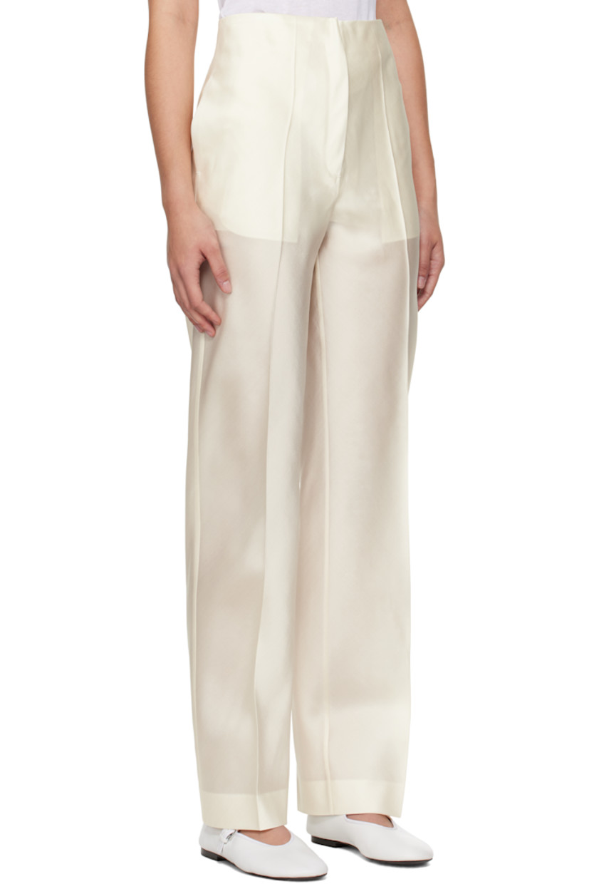 Silk satin trousers.

· Two-pocket styling
· Zip-fly
· Central creases at front and back
· Darts at back waistband

Supplier color: Cream