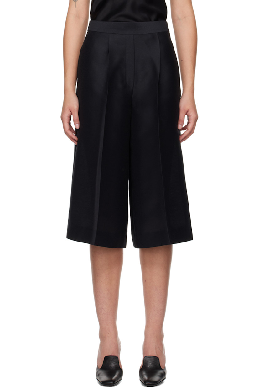 Polyester twill shorts.

· Two-pocket styling
· Mock-fly
· Pleats at front
· Concealed zip closure at outseam
· Darts at back waistband
· Central creases at back

Supplier color: Black
