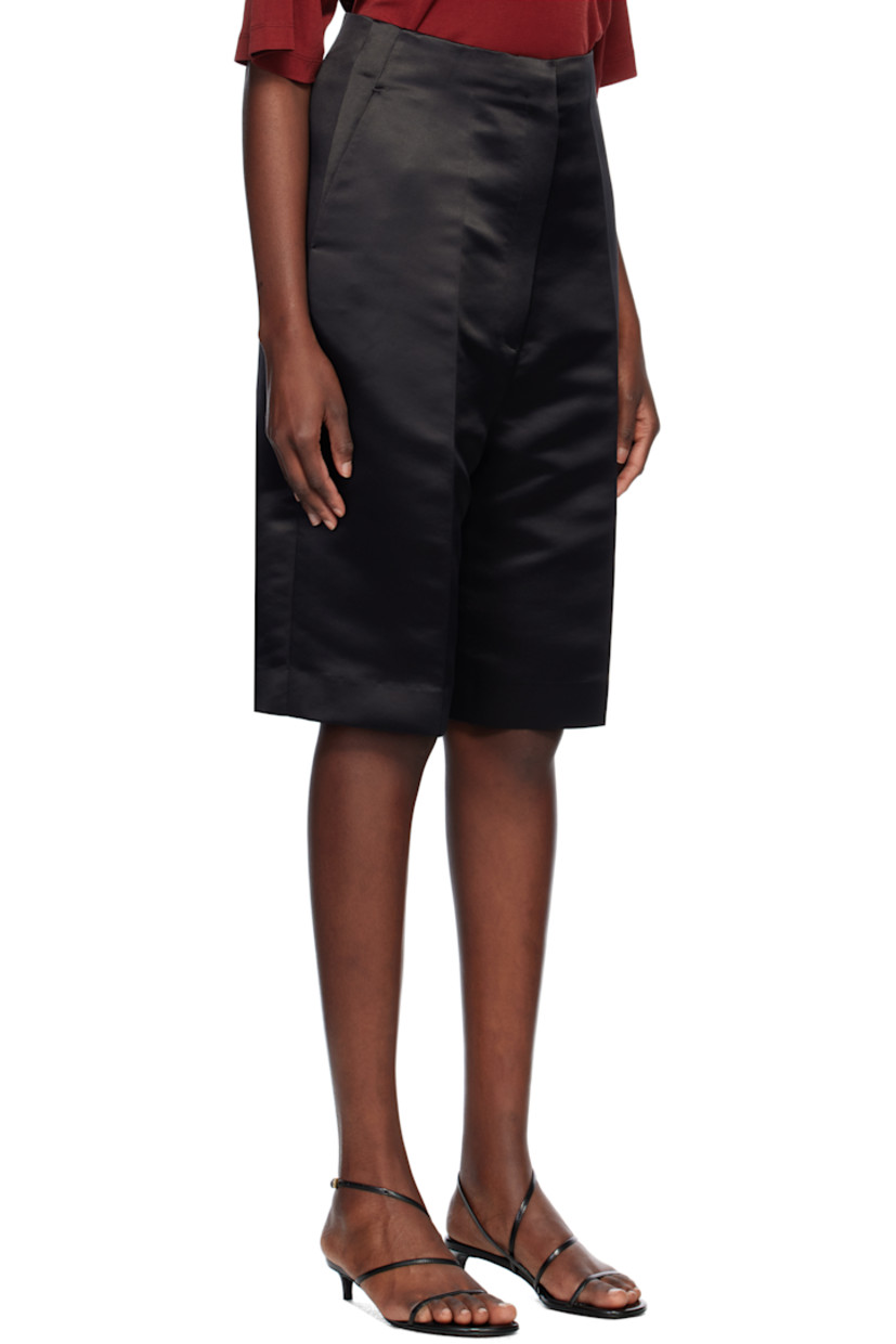 Recycled polyester satin shorts. 

· Two-pocket styling
· Zip-fly
· Creased legs
· Darts at back waistband

Supplier color: Black