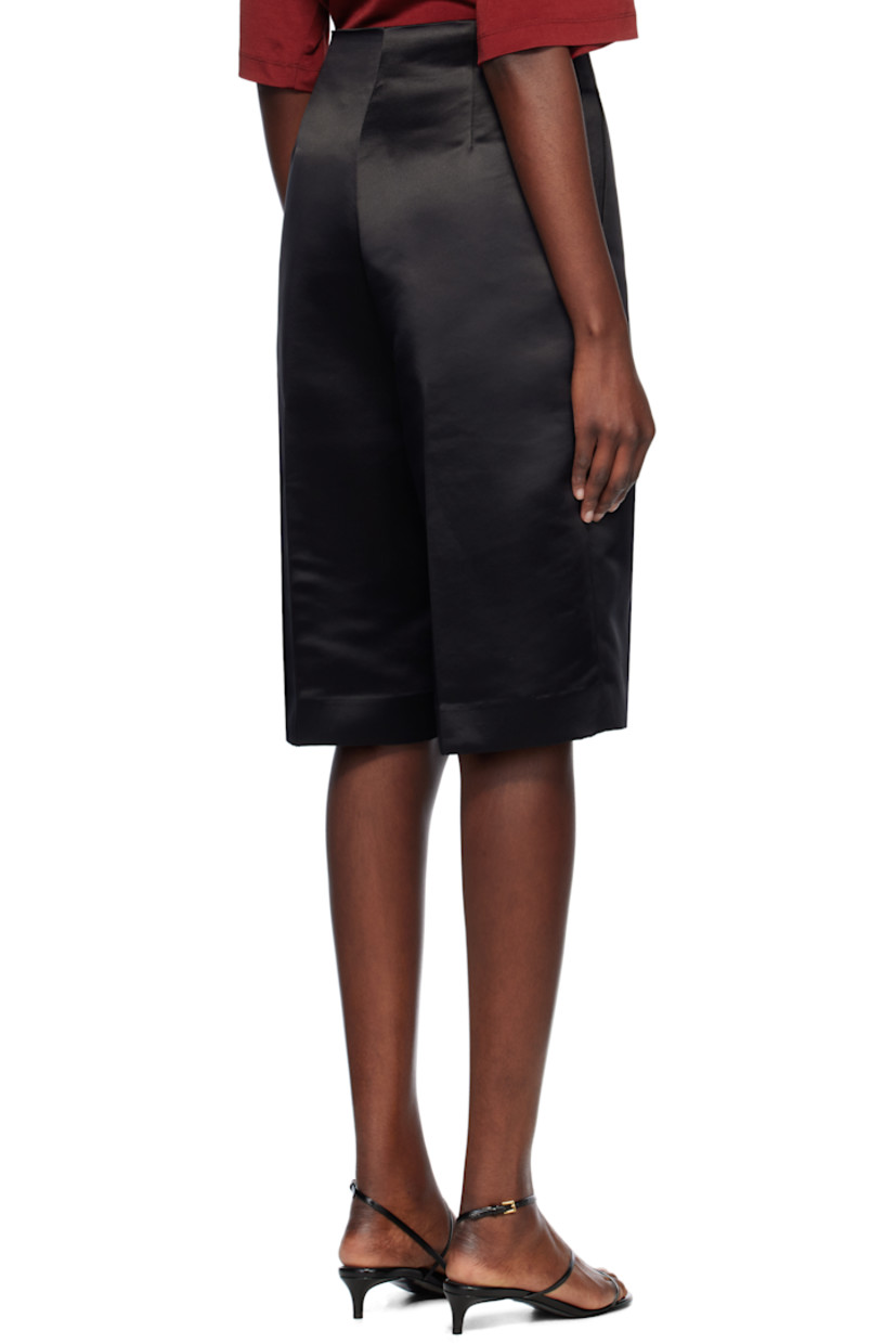Recycled polyester satin shorts. 

· Two-pocket styling
· Zip-fly
· Creased legs
· Darts at back waistband

Supplier color: Black