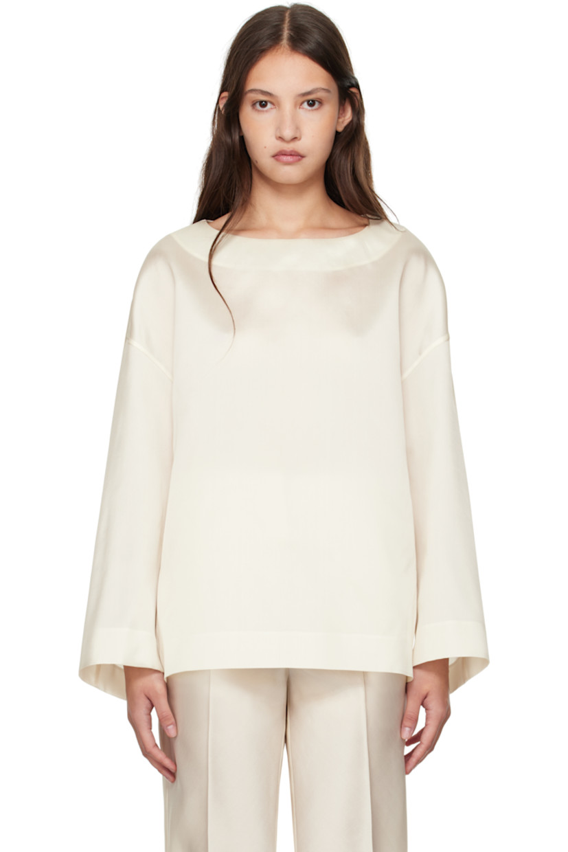 Semi-sheer silk satin blouse.

· Boat neck
· Dropped shoulders

Supplier color: Cream