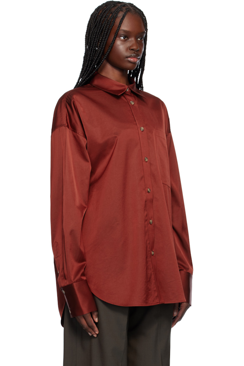 Acetate- and cotton-blend satin shirt. 

· Spread collar
· Button closure
· Patch pocket
· Shirttail hem
· Dropped shoulders
· Two-button barrel cuffs
· Twin pleats at back yoke

Supplier color: Red