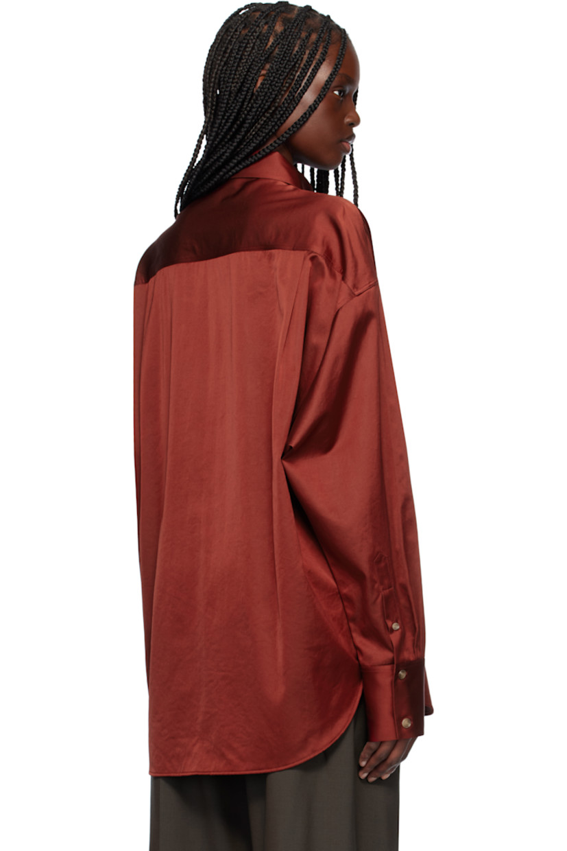 Acetate- and cotton-blend satin shirt. 

· Spread collar
· Button closure
· Patch pocket
· Shirttail hem
· Dropped shoulders
· Two-button barrel cuffs
· Twin pleats at back yoke

Supplier color: Red