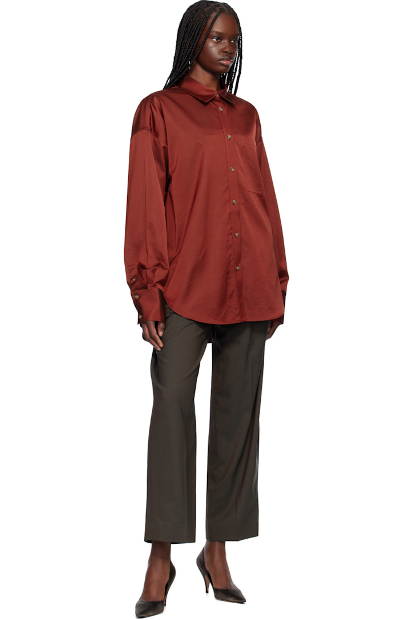 Acetate- and cotton-blend satin shirt. 

· Spread collar
· Button closure
· Patch pocket
· Shirttail hem
· Dropped shoulders
· Two-button barrel cuffs
· Twin pleats at back yoke

Supplier color: Red