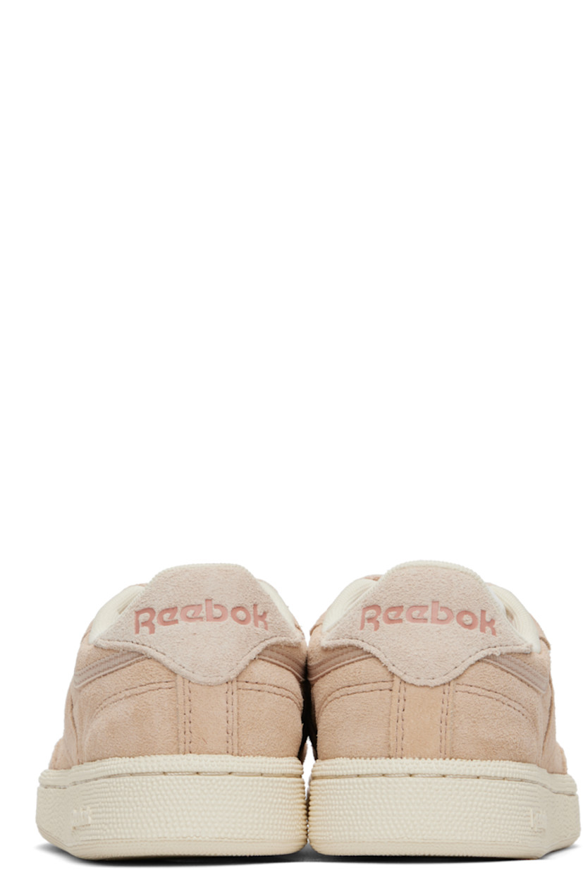 Low-top suede sneakers in beige.

· Perforated detailing at toe
· Lace-up closure
· Logo patch at padded tongue
· Padded collar
· Inset logo patch at outer side
· Logo printed at heel tab
· Mesh lining
· Treaded rubber sole

Supplier color: Tan/Sand/Clay