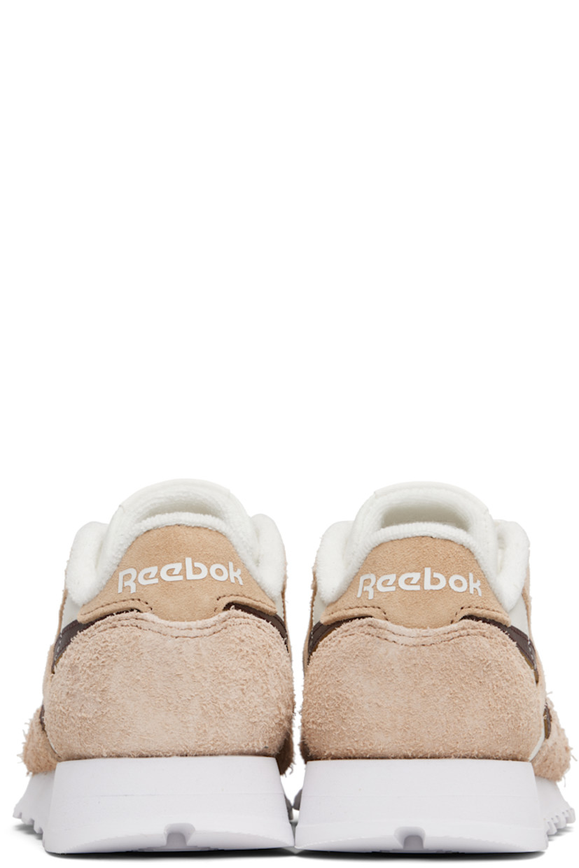 Low-top grained leather and brushed suede sneakers.

· Perforations at toe
· Lace-up closure
· Logo patch at padded tongue
· Padded collar
· Inset logo patch at outer side 
· Signature stripes at sides
· Logo printed at heel tab 
· Terrycloth lining
· Treaded foam rubber sole 

Supplier color: Chalk/Tan/Unearthed brown