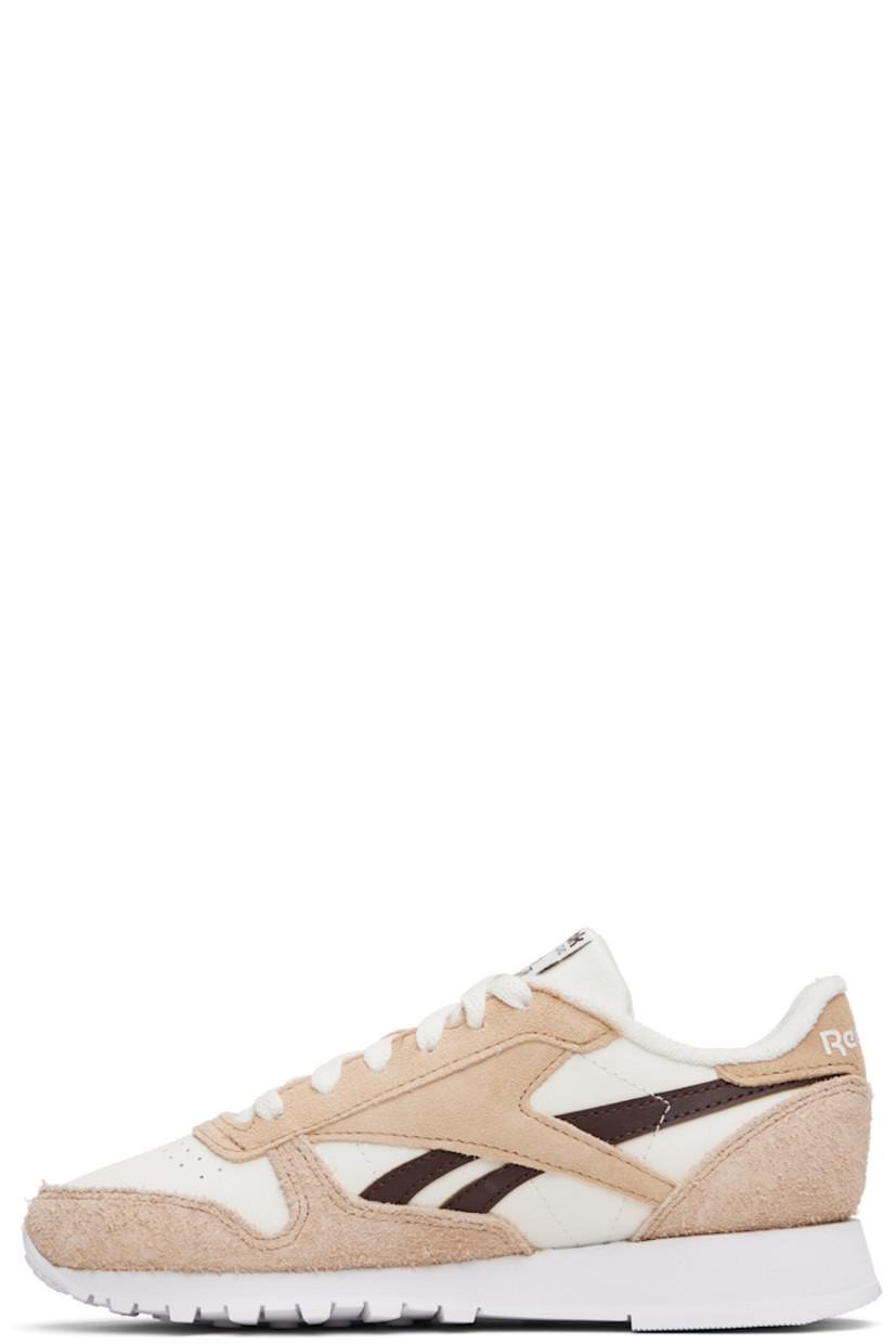 Low-top grained leather and brushed suede sneakers.

· Perforations at toe
· Lace-up closure
· Logo patch at padded tongue
· Padded collar
· Inset logo patch at outer side 
· Signature stripes at sides
· Logo printed at heel tab 
· Terrycloth lining
· Treaded foam rubber sole 

Supplier color: Chalk/Tan/Unearthed brown