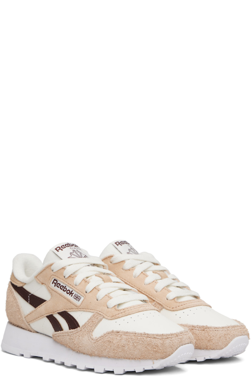 Low-top grained leather and brushed suede sneakers.

· Perforations at toe
· Lace-up closure
· Logo patch at padded tongue
· Padded collar
· Inset logo patch at outer side 
· Signature stripes at sides
· Logo printed at heel tab 
· Terrycloth lining
· Treaded foam rubber sole 

Supplier color: Chalk/Tan/Unearthed brown
