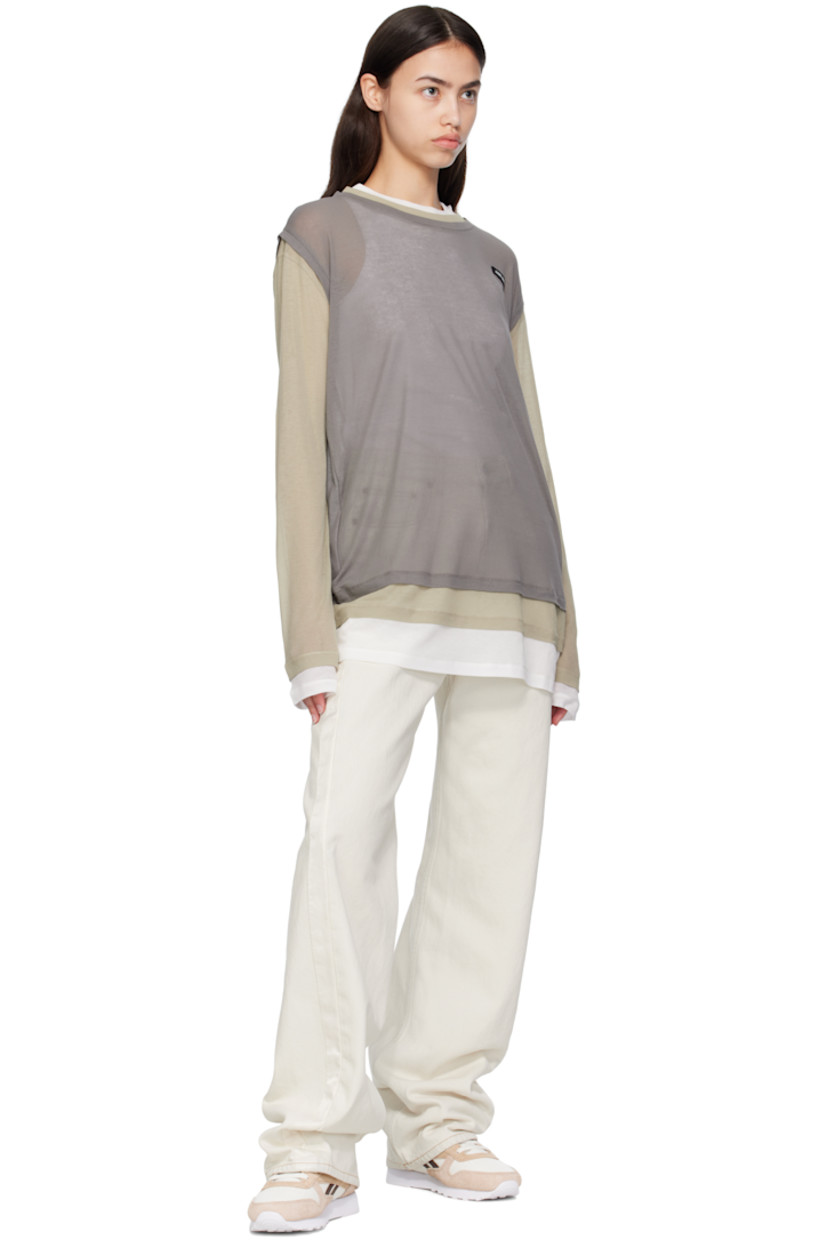Low-top grained leather and brushed suede sneakers.

· Perforations at toe
· Lace-up closure
· Logo patch at padded tongue
· Padded collar
· Inset logo patch at outer side 
· Signature stripes at sides
· Logo printed at heel tab 
· Terrycloth lining
· Treaded foam rubber sole 

Supplier color: Chalk/Tan/Unearthed brown