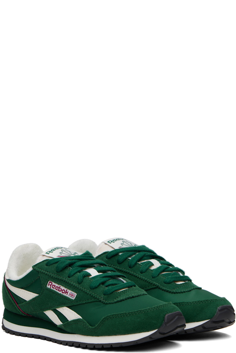 Low-top suede and canvas sneakers in green.

· Buffed leather trim throughout
· Lace-up closure
· Logo flag at padded tongue
· Padded collar
· Signature stripes at sides
· Inset logo patch at outer side
· Logo printed at heel tab
· Piping in burgundy at heel counter
· Terrycloth lining
· Foam rubber midsole
· Treaded rubber sole

Supplier color: Classic green/Classic green/Chalk