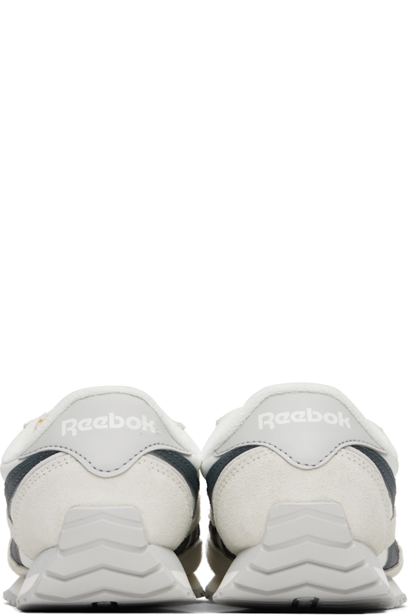 Low-top suede and canvas sneakers in white and gray.

· Lace-up closure
· Logo patch at padded tongue
· Padded collar
· Signature stripes at sides
· Inset logo patch at outer side
· Logo printed at heel tab
· Terrycloth lining
· Treaded rubber sole

Supplier color: Chalk/Chalk/Grey5