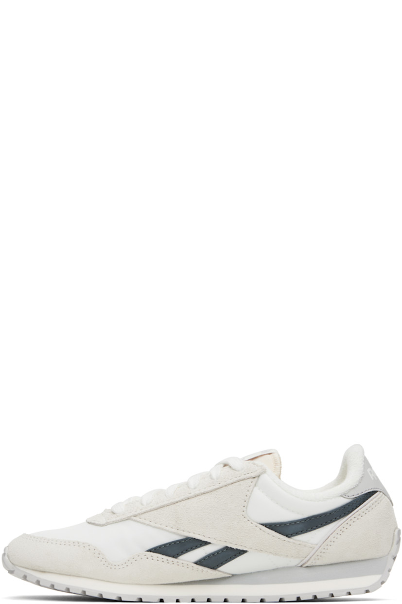 Low-top suede and canvas sneakers in white and gray.

· Lace-up closure
· Logo patch at padded tongue
· Padded collar
· Signature stripes at sides
· Inset logo patch at outer side
· Logo printed at heel tab
· Terrycloth lining
· Treaded rubber sole

Supplier color: Chalk/Chalk/Grey5