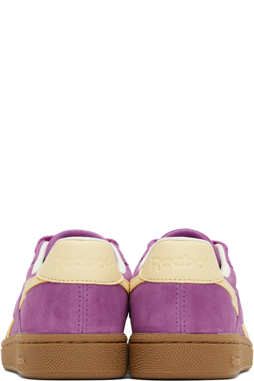 Low-top suede sneakers in purple.

· Perforated detailing at toe
· Lace-up closure
· Logo embossed at padded tongue
· Padded collar
· Inset logo patch at outer side
· Signature stripes at sides
· Logo embossed at heel tab
· Grained leather lining
· Logo embossed at textured rubber midsole
· Treaded rubber sole

Supplier color: Purplerave/Bleachedyellow/Chalk