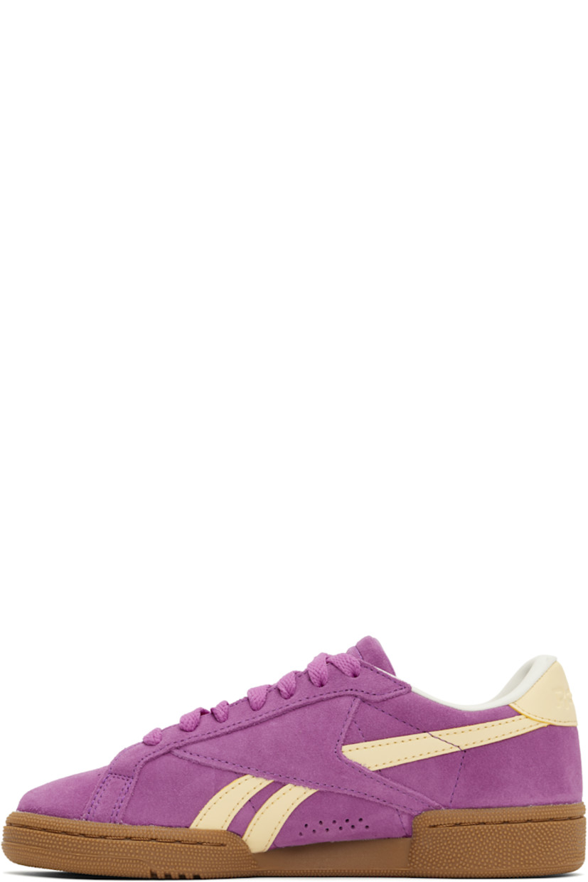 Low-top suede sneakers in purple.

· Perforated detailing at toe
· Lace-up closure
· Logo embossed at padded tongue
· Padded collar
· Inset logo patch at outer side
· Signature stripes at sides
· Logo embossed at heel tab
· Grained leather lining
· Logo embossed at textured rubber midsole
· Treaded rubber sole

Supplier color: Purplerave/Bleachedyellow/Chalk