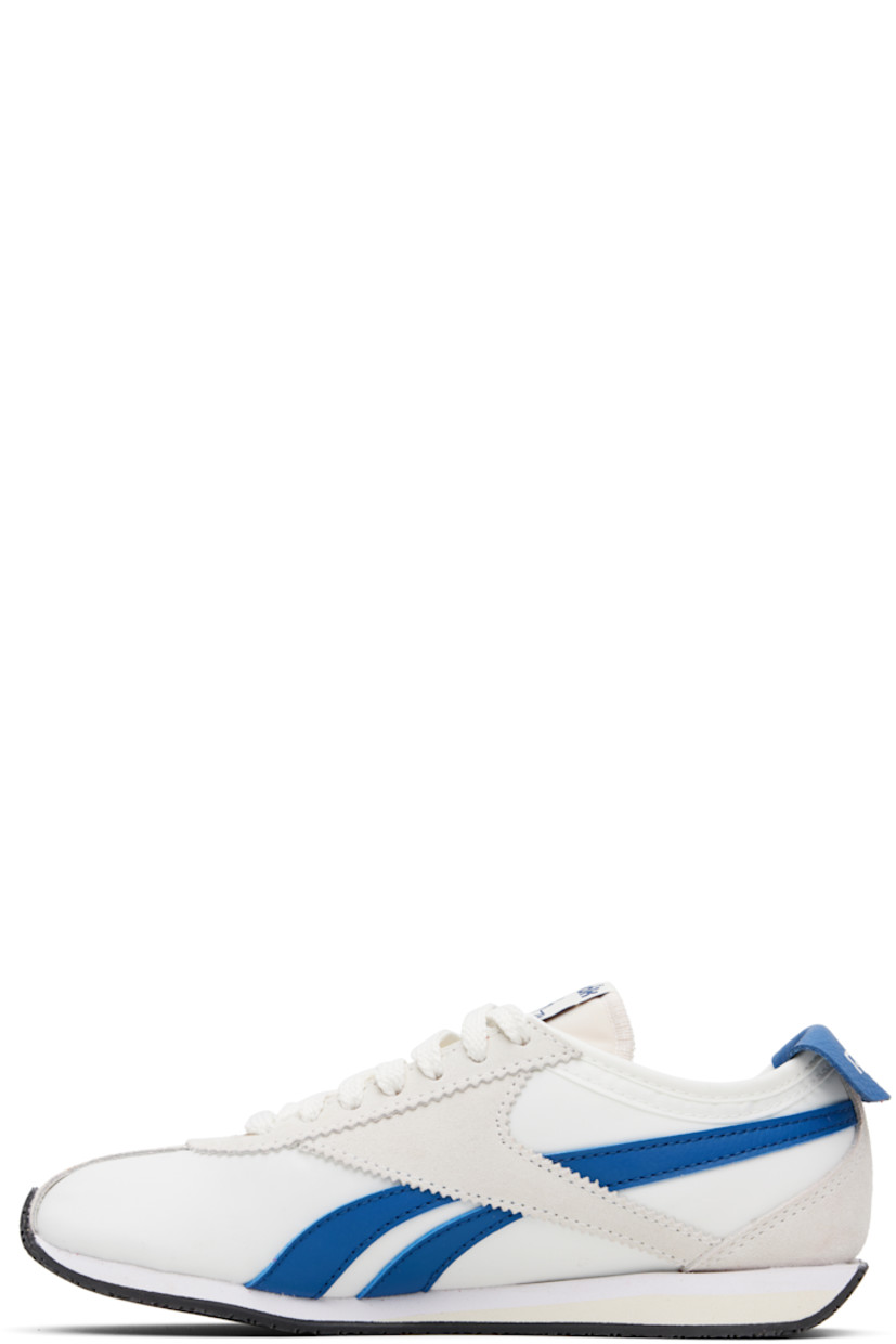 Low-top canvas and suede sneakers in off-white.

· Serrated edge at lace-up closure
· Logo patch at padded tongue
· Padded collar
· Signature stripes at sides
· Logo printed at grained leather foldover heel tab
· Jersey lining 
· Treaded rubber sole

Supplier color: Chalk/Chalk/Twilight blue
