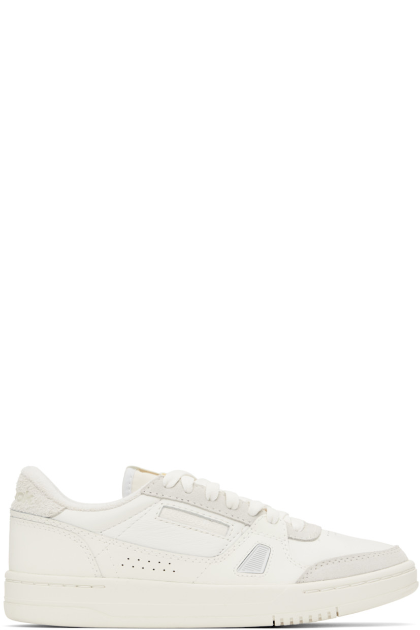 Low-top grained leather, suede, and canvas sneakers in white and gray. 

· Perforations at toe and sides 
· Lace-up closure
· Logo flag at padded tongue
· Padded collar
· Inset logo patch at outer side
· Inset rubberized trim at sides 
· Logo embossed at heel tab 
· Terrycloth lining 
· Treaded rubber non-marking sole

Supplier color: Chalk/Chalk/Moon