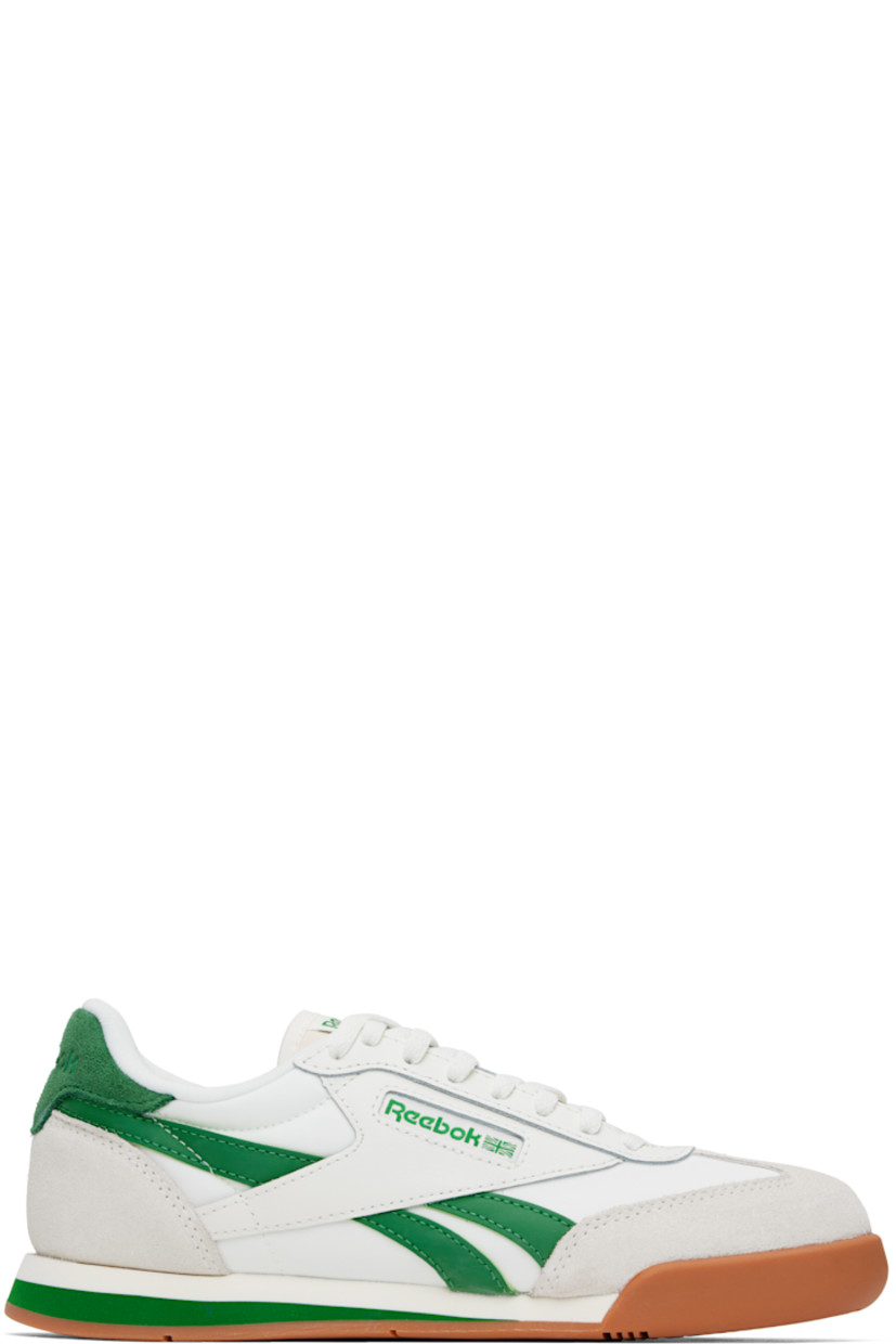 Low-top buffed leather, suede, and mesh sneakers in white and green.

· Lace-up closure
· Logo patch at padded tongue
· Padded collar
· Inset logo patch at outer side
· Signature stripes at sides
· Logo embossed at heel tab
· Jersey lining
· Treaded rubber sole

Supplier color: Chalk/Green/Gum