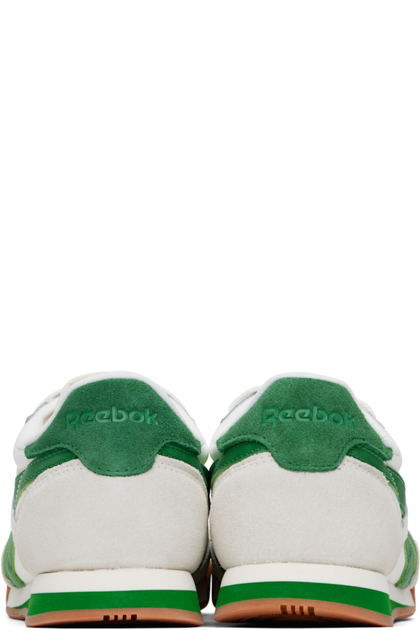 Low-top buffed leather, suede, and mesh sneakers in white and green.

· Lace-up closure
· Logo patch at padded tongue
· Padded collar
· Inset logo patch at outer side
· Signature stripes at sides
· Logo embossed at heel tab
· Jersey lining
· Treaded rubber sole

Supplier color: Chalk/Green/Gum