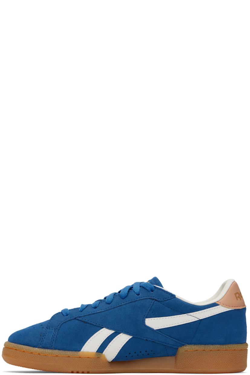 Low-top suede sneakers in blue.

· Perforated detailing at toe
· Lace-up closure
· Logo embossed at padded tongue
· Padded collar
· Inset logo patch at outer side
· Signature stripes at sides
· Logo printed at heel tab
· Grained leather lining
· Treaded rubber sole

Supplier color: Twilightblue/Clay/Chalk
