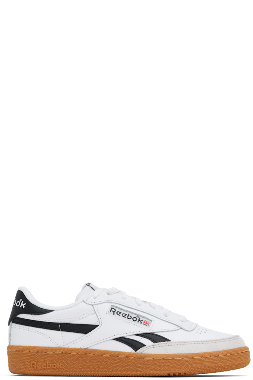 Low-top buffed leather sneakers in white and black.

· Suede trim at toe
· Perforated detailing at vamp
· Lace-up closure
· Logo patch at padded tongue
· Padded collar
· Inset logo patch at outer side
· Signature stripes at sides
· Logo printed at heel tab
· Terry cloth lining
· Treaded rubber sole

Supplier color: White/Black/Gum