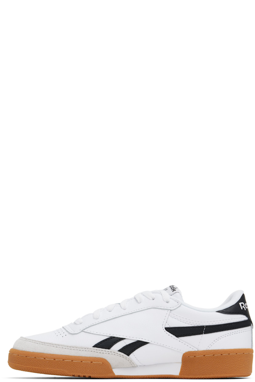 Low-top buffed leather sneakers in white and black.

· Suede trim at toe
· Perforated detailing at vamp
· Lace-up closure
· Logo patch at padded tongue
· Padded collar
· Inset logo patch at outer side
· Signature stripes at sides
· Logo printed at heel tab
· Terry cloth lining
· Treaded rubber sole

Supplier color: White/Black/Gum