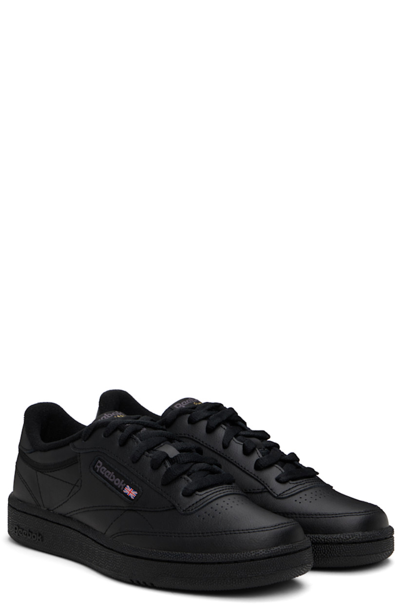 Low-top buffed leather sneakers in black.

· Perforated detailing at vamp
· Lace-up closure
· Logo patch at padded tongue
· Padded collar
· Inset logo patch at outer side
· Logo printed at heel tab
· Terry cloth lining
· Foam rubber midsole
· Treaded rubber sole

Supplier color: Int black/Charcoal