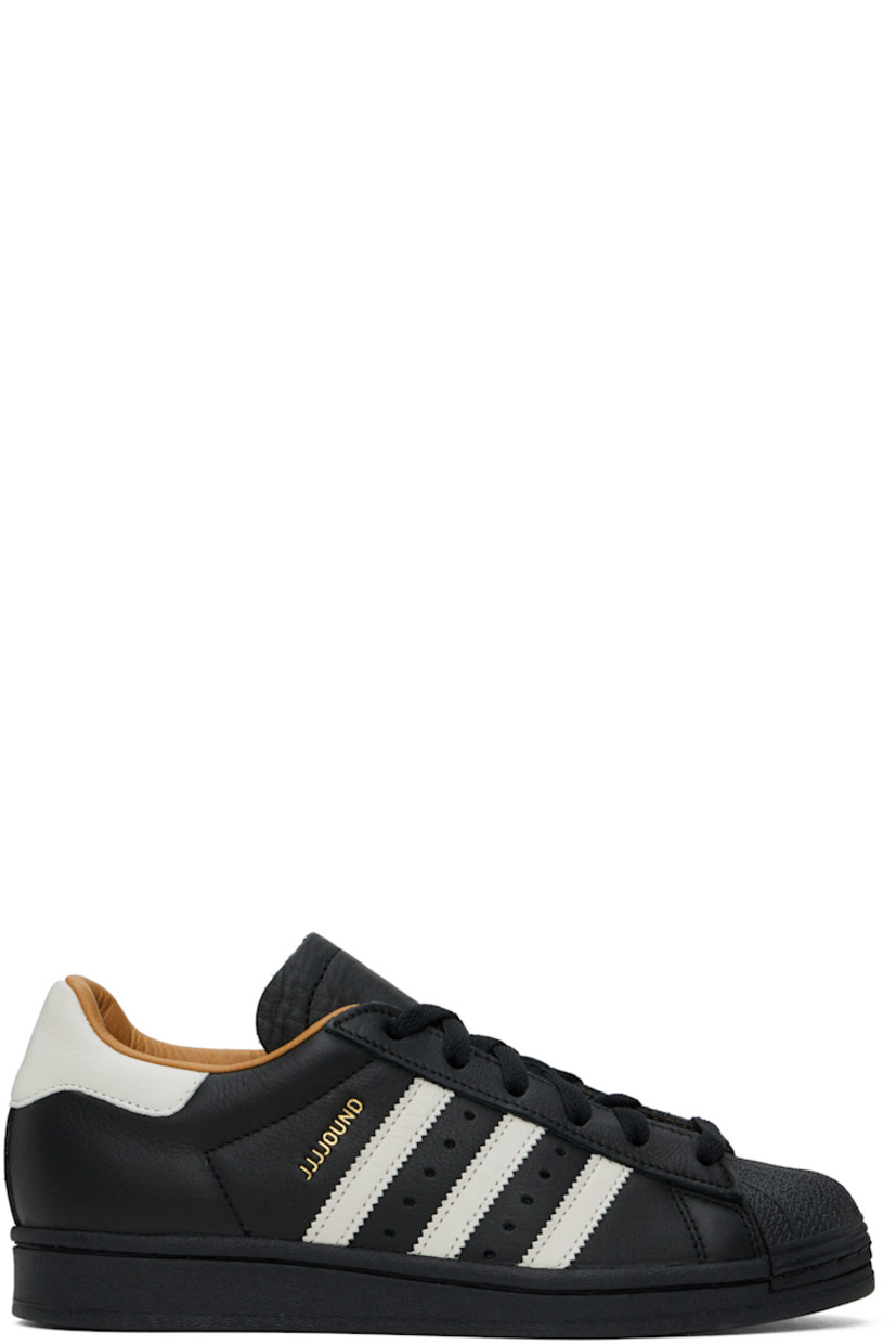 Low-top grained leather sneakers in black.

· Textured rubber cap toe
· Lace-up closure
· Padded tongue and collar
· Perforations and signature stripes at sides
· Logo stamp at outer side
· Buffed leather and mesh lining
· Treaded rubber sole

Part of the adidas Originals x JJJJound collaboration.

Supplier color: Core black/Off white/Core black