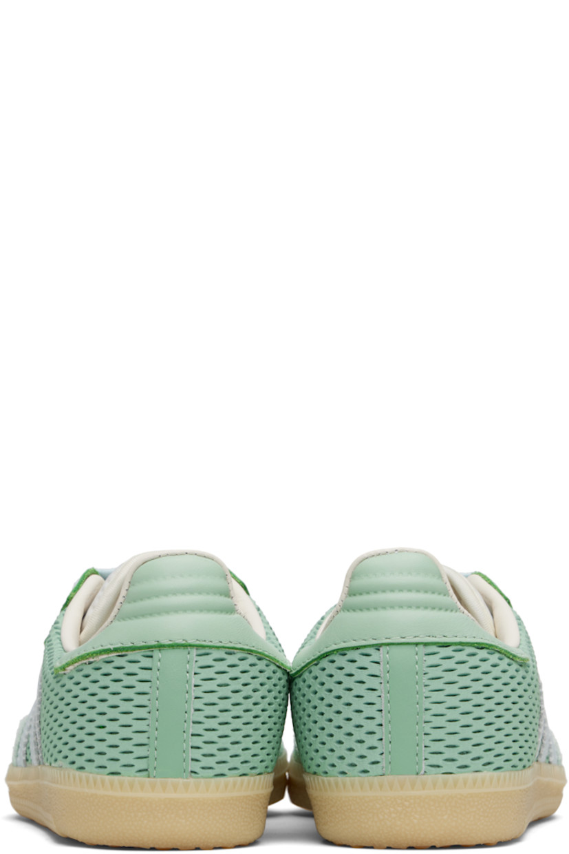 Low-top perforated leather and buffed leather sneakers.

· Nubuck trim at toe
· Lace-up closure
· Logo printed at tongue
· Padded tongue and collar
· Signature serrated stripes at sides
· Quilted heel tab
· Mesh lining
· Treaded rubber sole

Supplier color: Hazy green/Sky tint/Off white