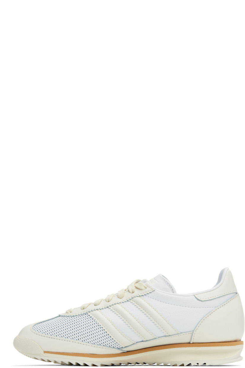 Low-top mesh, grained leather, and buffed leather sneakers off-white and white.

· Lace-up closure
· Logo bonded at tongue
· Padded collar
· Signature serrated stripes at sides
· Buffed faux-leather and mesh lining
· Logo embossed at foam rubber midsole
· Treaded rubber sole

Supplier color: Cloud white/Off white/Gum