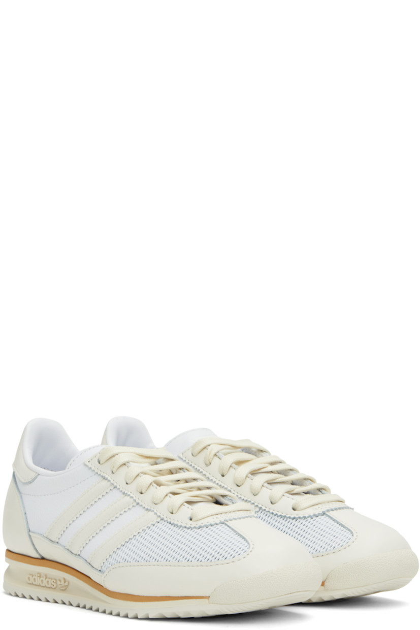 Low-top mesh, grained leather, and buffed leather sneakers off-white and white.

· Lace-up closure
· Logo bonded at tongue
· Padded collar
· Signature serrated stripes at sides
· Buffed faux-leather and mesh lining
· Logo embossed at foam rubber midsole
· Treaded rubber sole

Supplier color: Cloud white/Off white/Gum