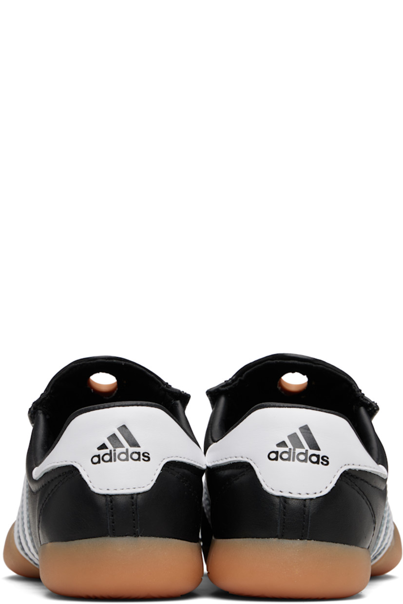 Low-top buffed leather slip-on sneakers.

· Cutout and rubberized trim at vamp
· Concealed elasticized gussets
· Padded collar
· Signature serrated stripes at sides
· Logo embossed at heel tab
· Buffed leather and mesh lining
· Treaded rubber sole

Supplier color: Core black/Cloud white/Gum