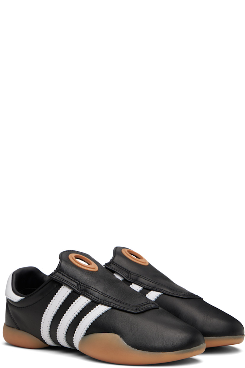Low-top buffed leather slip-on sneakers.

· Cutout and rubberized trim at vamp
· Concealed elasticized gussets
· Padded collar
· Signature serrated stripes at sides
· Logo embossed at heel tab
· Buffed leather and mesh lining
· Treaded rubber sole

Supplier color: Core black/Cloud white/Gum
