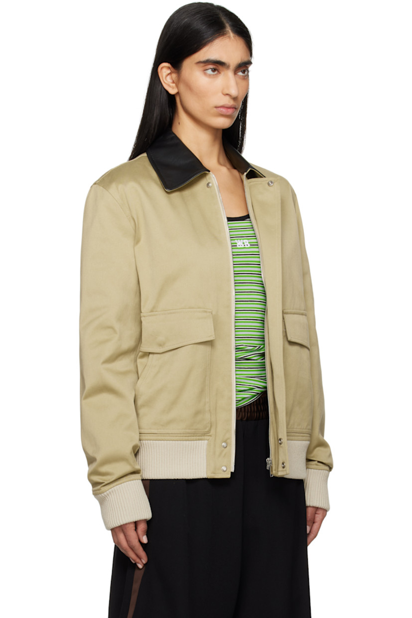 Cotton sateen jacket. 

· Leather trim at spread collar 
· Concealed zip closure with press-stud placket
· Flap and welt pockets
· Rib-knit hem and cuffs 
· Central seam at back 
· Welt pocket at interior 
· Full quilted viscose twill lining 

Supplier color: Hunter