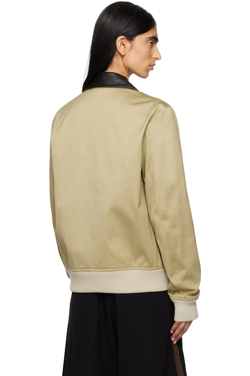 Cotton sateen jacket. 

· Leather trim at spread collar 
· Concealed zip closure with press-stud placket
· Flap and welt pockets
· Rib-knit hem and cuffs 
· Central seam at back 
· Welt pocket at interior 
· Full quilted viscose twill lining 

Supplier color: Hunter
