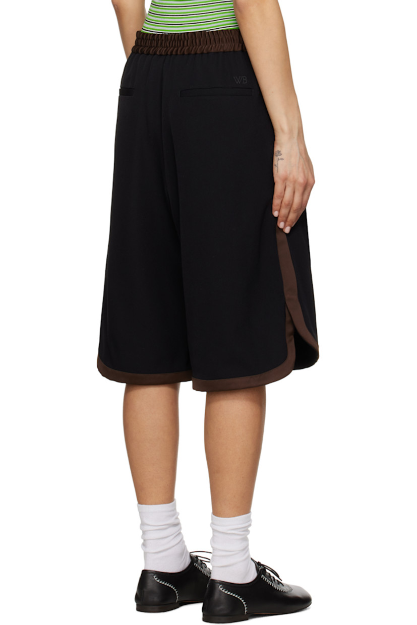 Relaxed-fit wool twill shorts. Satin trim throughout.

· Elasticized waistband
· Four-pocket styling 
· Mock fly 
· Vented cuffs

Supplier color: Black/Brown