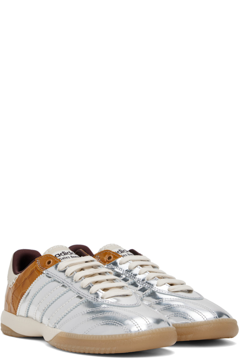 Low-top paneled lamé and croc-embossed leather sneakers in silver tone and brown. 

· Lace-up closure
· Logo patch at padded tongue
· Padded collar
· Serrated signature stripes at sides
· Blanket stitching and logo embossed at suede heel tab
· Satin lining
· Treaded Torsion System® rubber sole
· Contrast stitching in white

Part of the Wales Bonner x adidas Originals collaboration.

Supplier color: Silver metallic/Silver metallic/Easy yellow