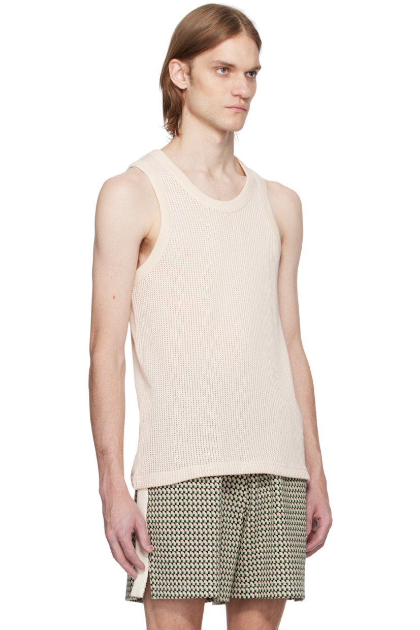 Open-knit cotton tank top. 

· Rib-knit crewneck and armscyes
· Embroidered logo patch at front hem

Supplier color: Ivory